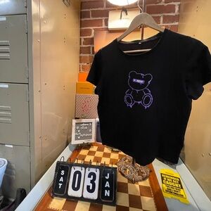 purple teddy bear design is displayed,